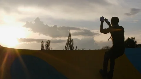 Young man demonstrating  roller skating on the ramp in slow motion during the Stock Footage 110891523