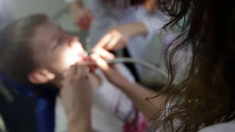 Young man in the dentist's office. Stock Footage 129744396
