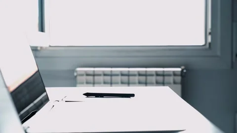 Young man designer using a stylus and graphics table. Person teleworking from Stock Footage 133233665