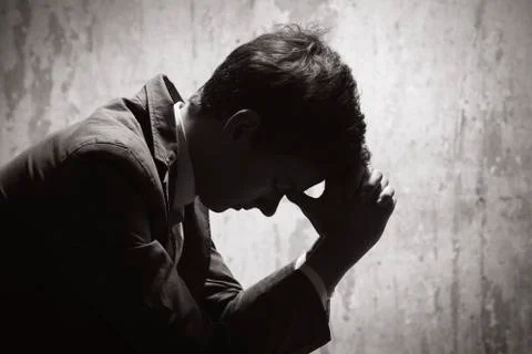 Young man in despair Stock Photos