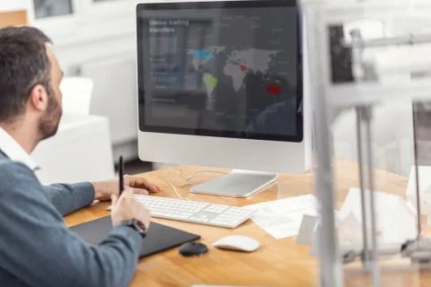 Young man developing a presentation about trading Stock Photos