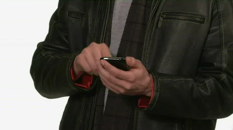 Young man dials cell phone 库存影片 399620