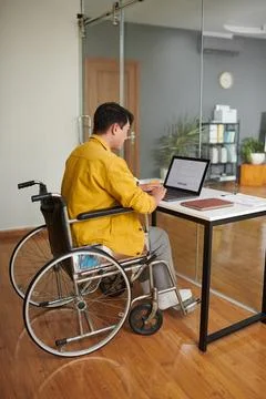 Young Man with Disability Coding Stock Photos