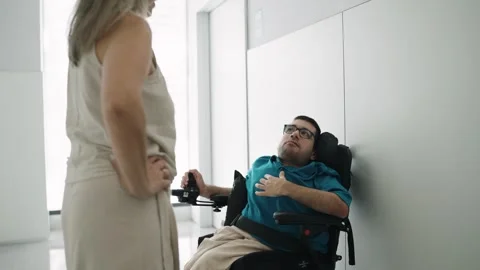 Young man with a disability having breathing difficulties with a nurse Stock Footage 339323891