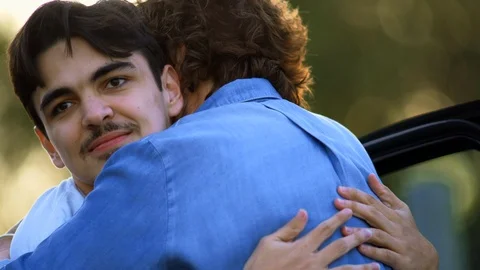 Young man with a disability hugging his carer. Vidéo 88374938
