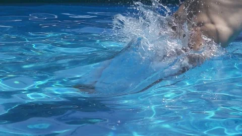 Young Man Dive in Swimming Pool,Slow Motion Stock Footage 76384872