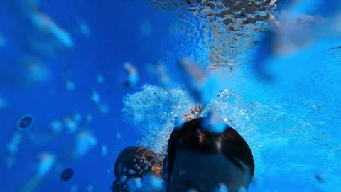 Young man dives into the pool with his hands forward. Selfie Stock Footage 276669583