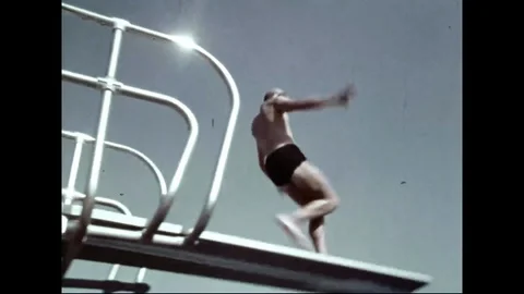 Young Man Diving In Swimming Pool Stock Footage 102809983