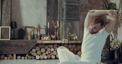 A young man does exercise and gymnastics at home during pandemics and covid 19. Stock Footage 146705090