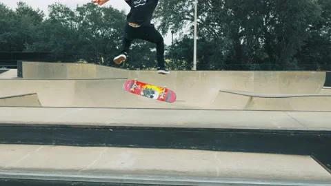 Young Man Does Flip Trick Of Ledge At A Skatepark Video stock 167987745