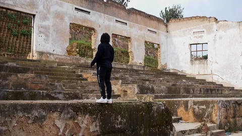 Young man does flips in the warehouse Stock Footage 117614740