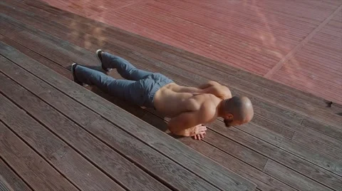 The young man does gymnastic exercises Stock Footage 66729628