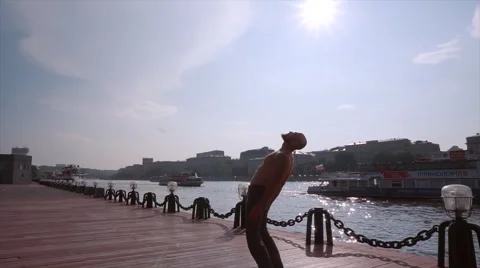 The young man does gymnastic exercises Stock-Footage 66729636