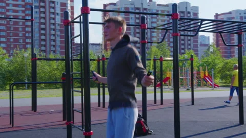 A young man does his street workout on a summer day Video stock 146183766