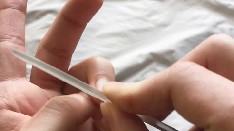 Young Man Does Manicure Himself. Ugly manicure. Hand with manicure ugly. Show Video stock 125398974