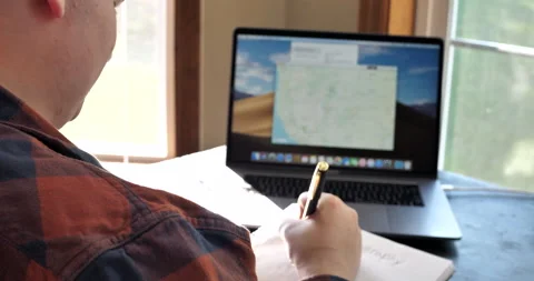 Young man does remote schooling from home. Video stock 141231215