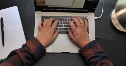 Young man does school work on computer. Stock Footage 141231361