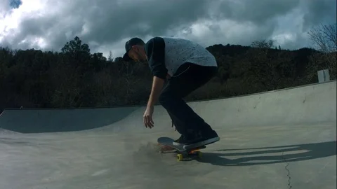 Young Man Does Skateboard Trick with Skateboard on Fire in Slow Motion Stock Footage 73061102
