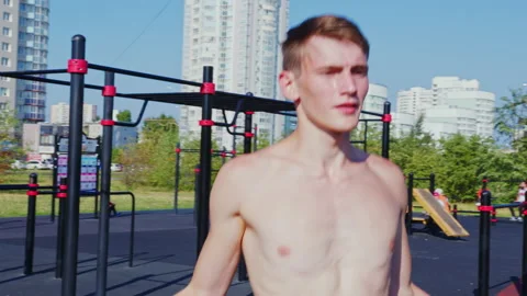 A young man does a street workout Video stock 145708608