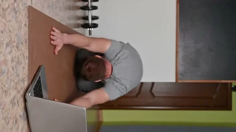 Young man does stretching on rug in room at home. New normal. Stock Footage 132793785