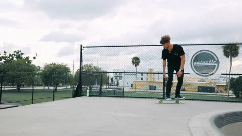 Young Man Does Trick Down Big Ledge At Skatepark Video stock 168042111