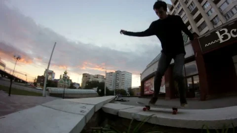 Young man does a trick on a skateboard and falls in the face of the ground Stock Footage 69789507