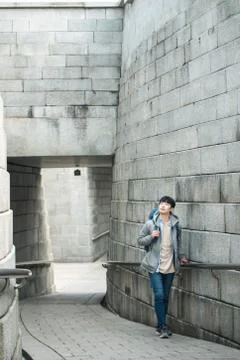 A young man doing a backpacking trip in a Korean traditional house. Stock Photos