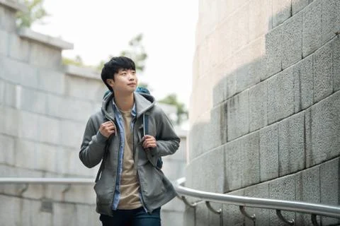 A young man doing a backpacking trip in a Korean traditional house. Stock-Fotos