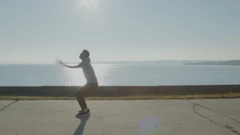 Young Man Is Doing Backward Flip Stock Footage 165675057