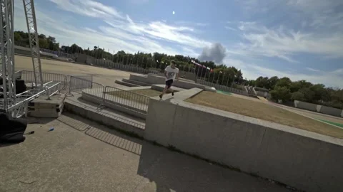 Young man doing a big running jump in Montreal Parkour Slow motion Vídeos de archivo 163584979