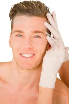 Young man doing botox injections Stock Photos