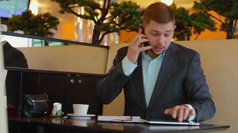 Young man doing business over the phone Stock-Footage 30350708