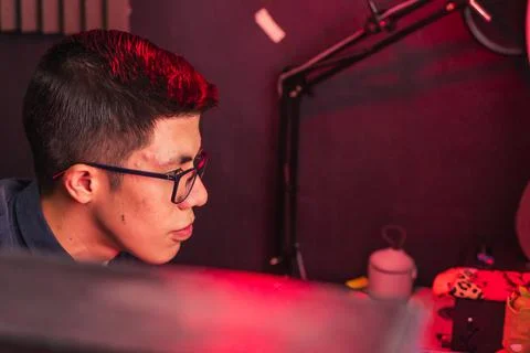 Young man doing different tasks on his computer. Foto stock