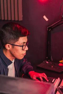 Young man doing different tasks on his computer. Foto stock