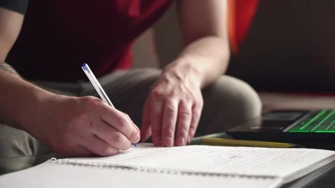 Young man is doing distance learning at home using a computer. coronavirus Stock Footage 207782635