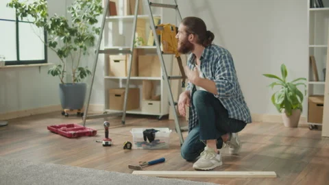 Young Man Doing DIY Repairs at Home Feeling Pain in his hand. Stock Footage 260518708