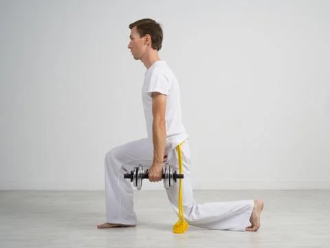 Young Man doing Exercise with Dumbbells Stock Photos