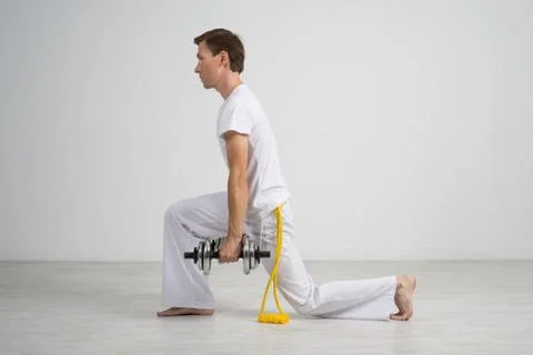 Young Man doing Exercise with Dumbbells Stock Photos