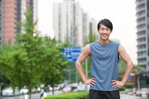 Young man doing exercise outside Stock Photos