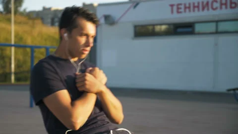 Young man doing an exercise on the press Stock Footage 122839537