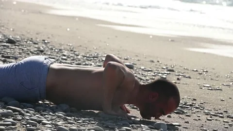 Young man doing exercise at the sea shore Video stock 231017512