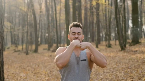 Young Man Doing Exercises In The Forest. Vídeos de archivo 120650166