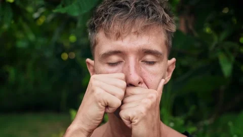Young Man Doing Face Massage by Self Hands at Yoga Meditation in Green Nature Stock Footage 278153925