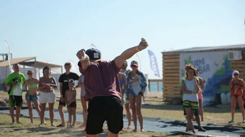 Young Man Doing Flip And Twine in The Sand. Video stock 59424305