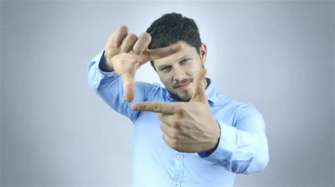 Young man doing a frame with his hands 動画素材 41795405