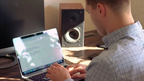 Young man doing an internet search on a laptop Stock Footage 125896687