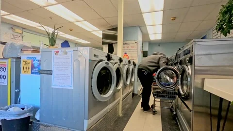 Young man Doing Laundry Stock Footage 170761256