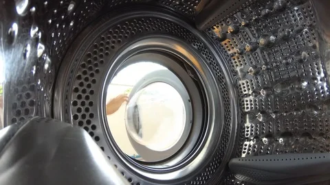 Young man doing laundry in the home 動画素材 92339688