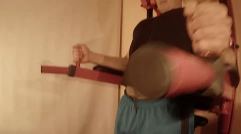 Young Man Doing Leg Lifts on the Wall Bars Stock Footage 62475669
