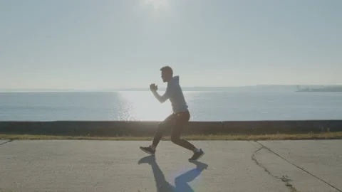 Young Man Is Doing Lower Body Exercise Stock Footage 165675592